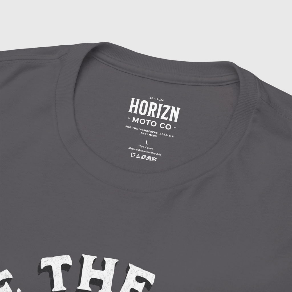 Back view of a man with a beard wearing a grey heavyweight Chase the Horizn Skull Rider Tee, showcasing premium cotton material and relaxed fit for riders.