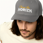Chase the Horizn embroidered moto cap in dark grey featuring bold yellow and white lettering, perfect for adventure seekers and moto enthusiasts.