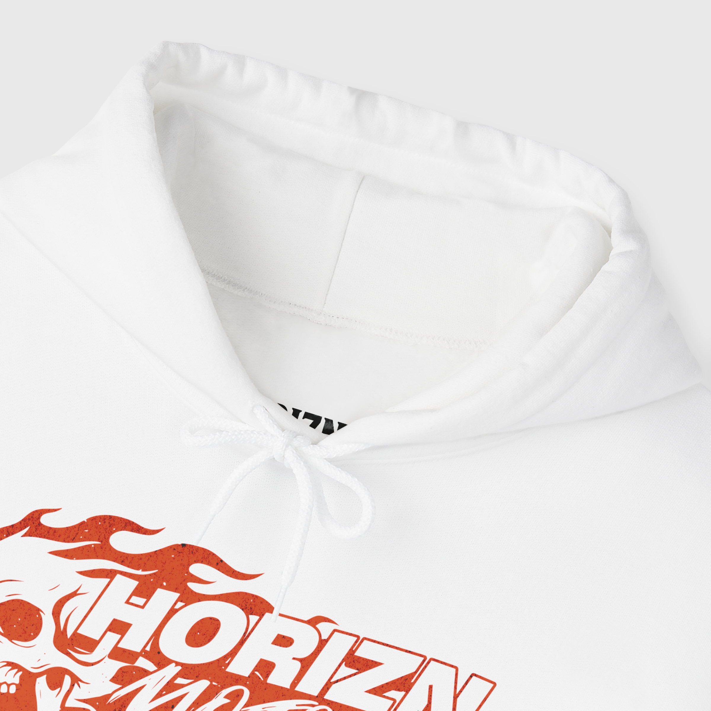 White Flame Skull Hoodie worn by male model with short hair, featuring bold red flame graphics on sleeve, designed for moto streetwear enthusiasts.