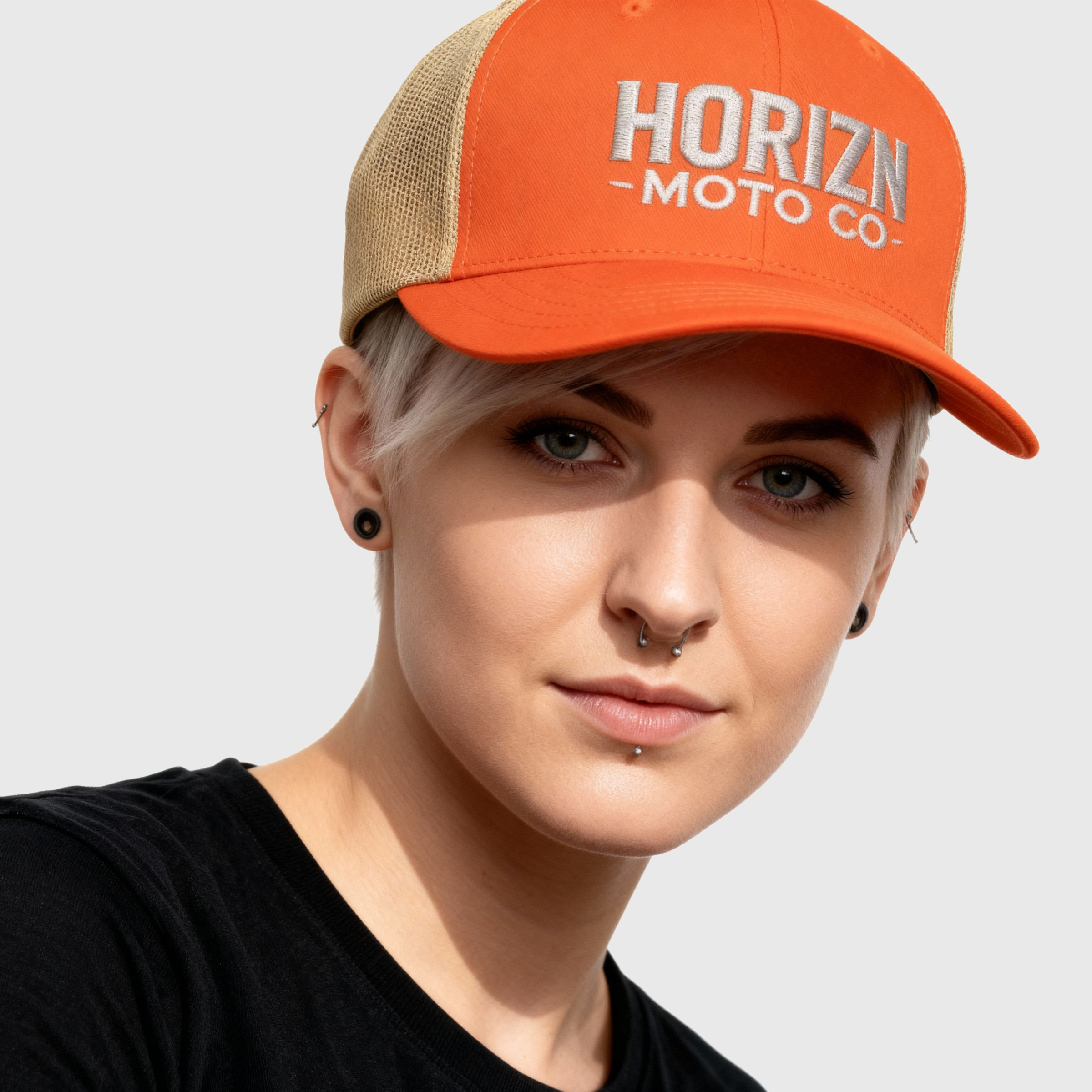 Orange Mesh Moto Trucker Cap with embroidered HORIZN MOTO CO logo, featuring a bold orange front and breathable tan mesh back, perfect for riders and urban creatives.