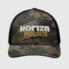 Camo Mesh Trucker Cap with HORIZN MotoCo Logo in white and gold embroidery, featuring breathable black mesh back and curved brim for rugged style.