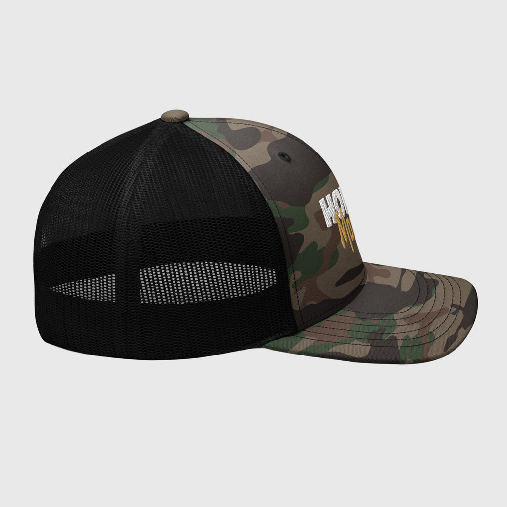 Camo Mesh Trucker Cap featuring white 'HORIZN' logo and gold 'MotoCo' graphic, designed for riders and city drifters, with structured front panel and breathable mesh rear.