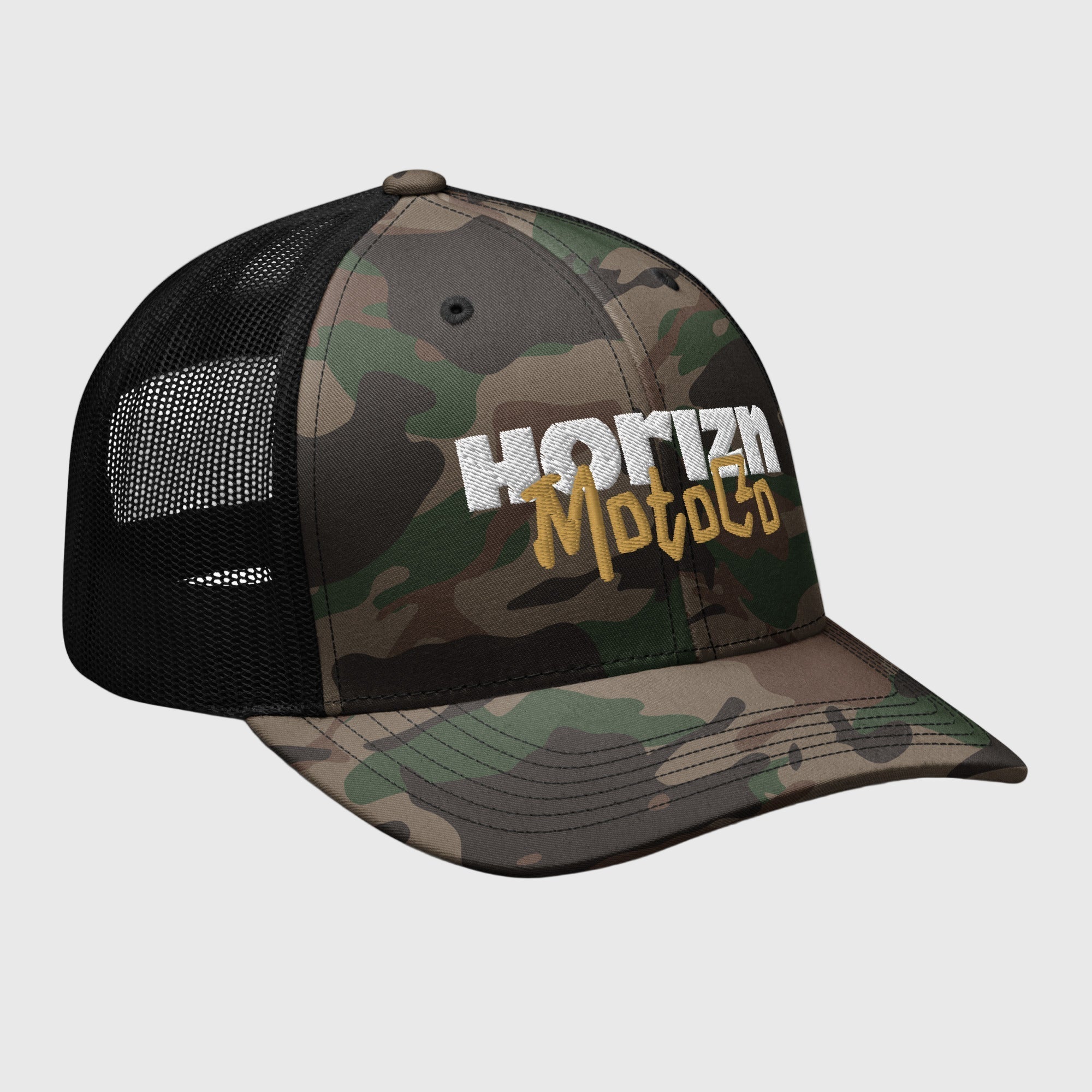 Camo Mesh Trucker Cap featuring white 'HORIZN' logo and gold 'MotoCo' graphic, designed for riders and urban explorers.