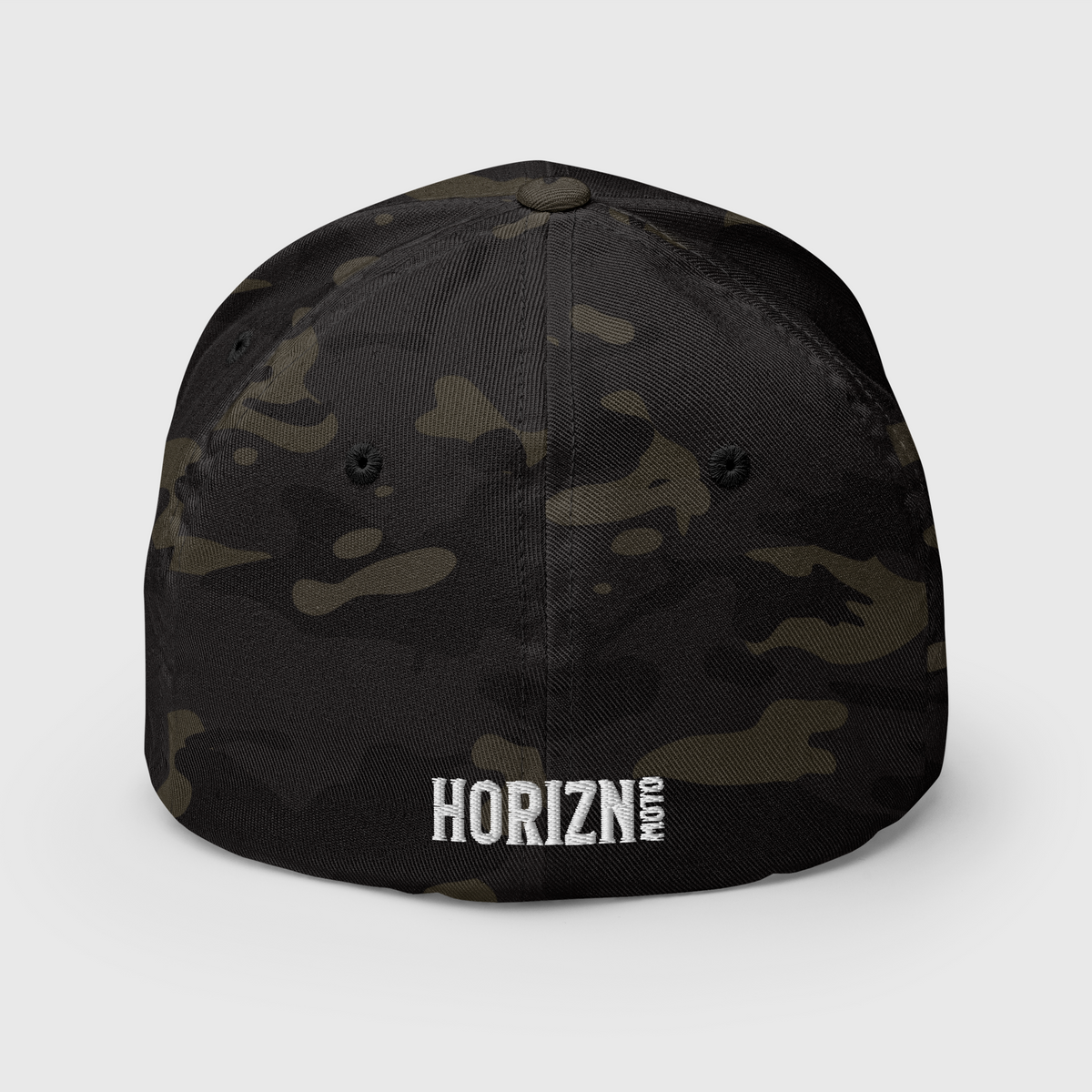 Rear view of the Multicam Black camouflage Chase the HORIZN Flexfit cap, showing the small white HORIZN embroidery at the back.