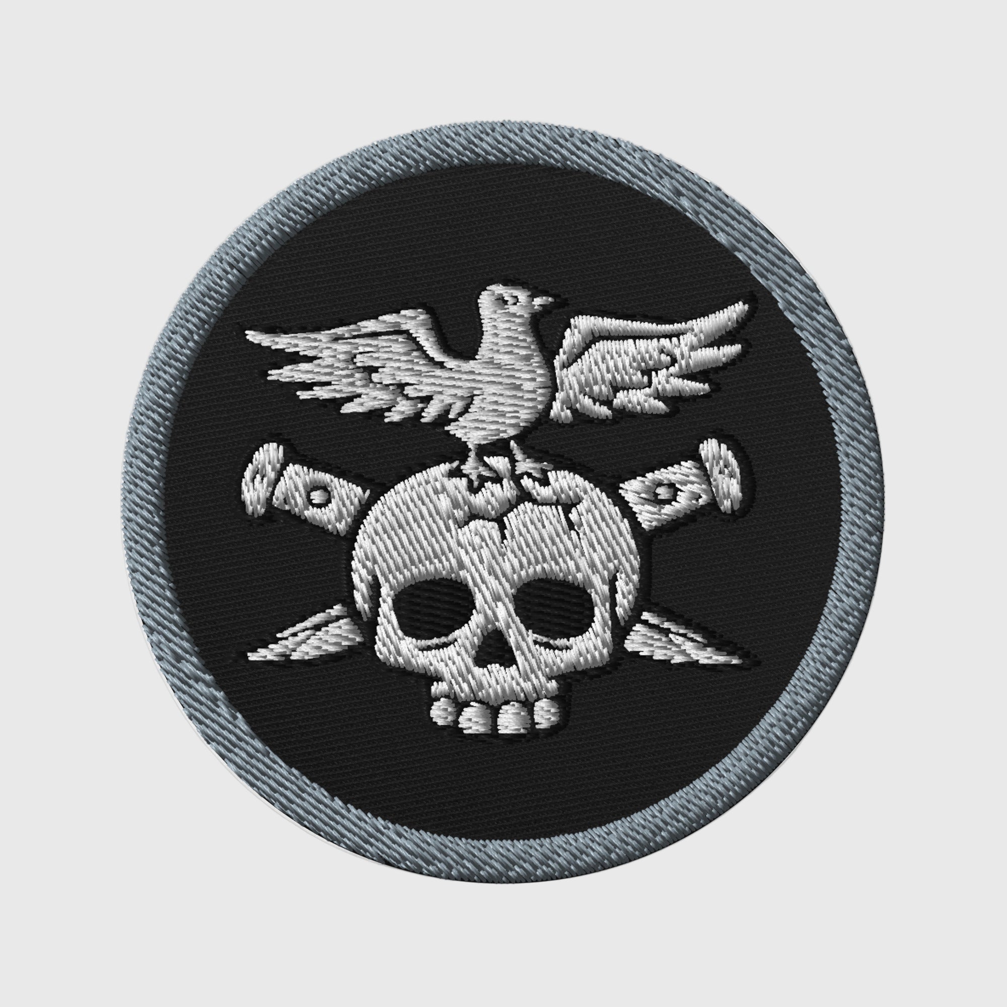 Embroidered patch featuring a skull and eagle design, 3 inches in diameter, ideal for personalizing outfits with a touch of moto-inspired style.