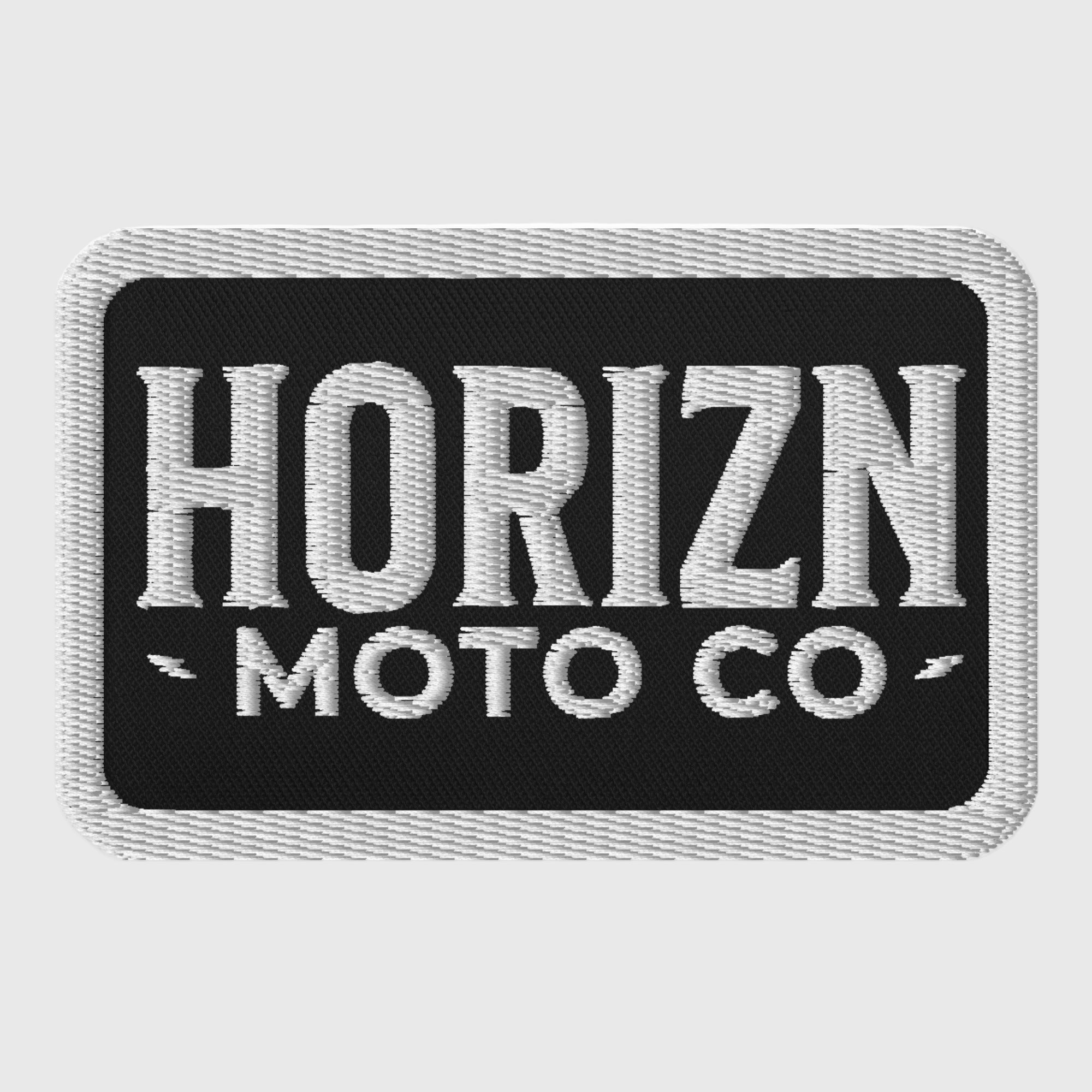 HORIZN MOTO embroidered patch on durable twill fabric, featuring a bold black background with white lettering, perfect for personalizing jackets and bags.