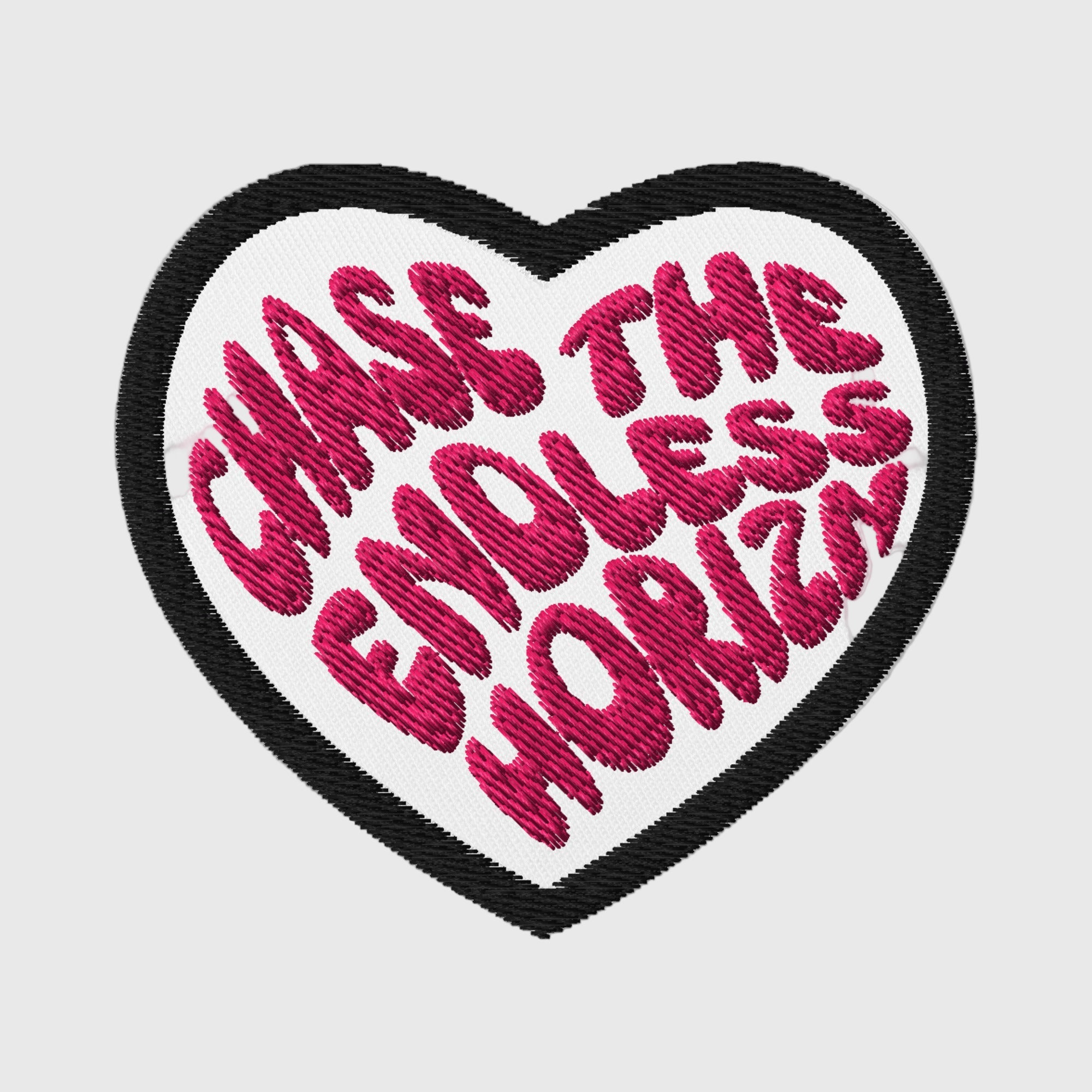Embroidered patch featuring the phrase 'Chase the Endless Horizn' in vibrant pink, set on a heart-shaped white background with a black border, perfect for personalizing moto apparel.