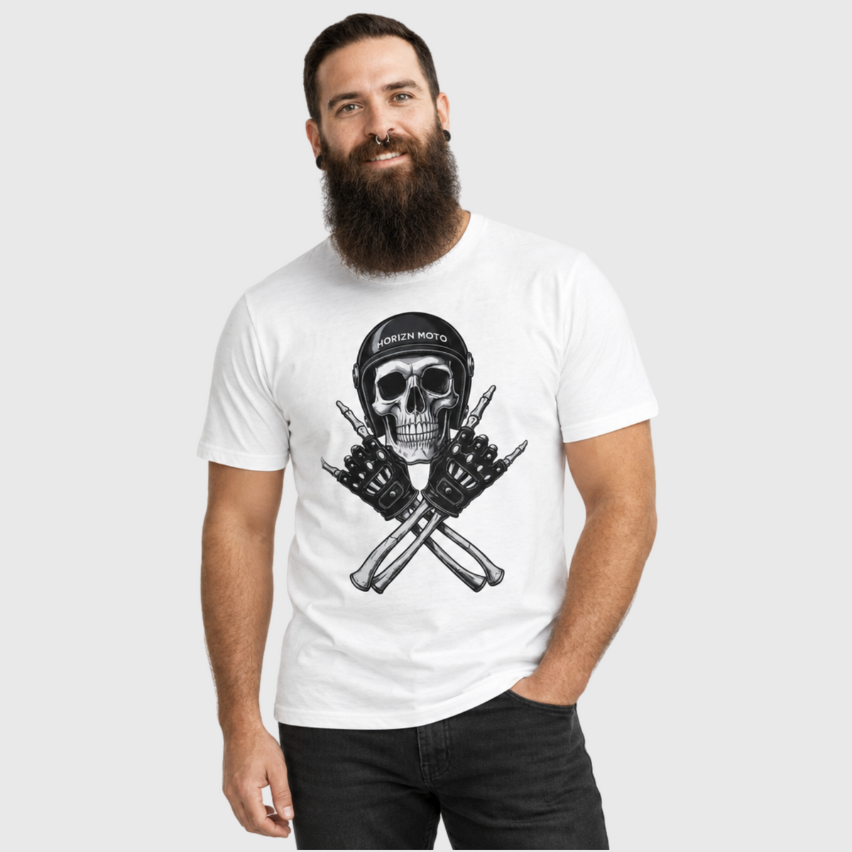 Model wearing the white Rebel Bones Moto Tee, featuring the black skull helmet and crossed-gloves design.
